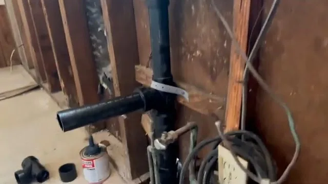 Exposed trenchless sewer pipe beneath floor, on this Rockwall plumbing job